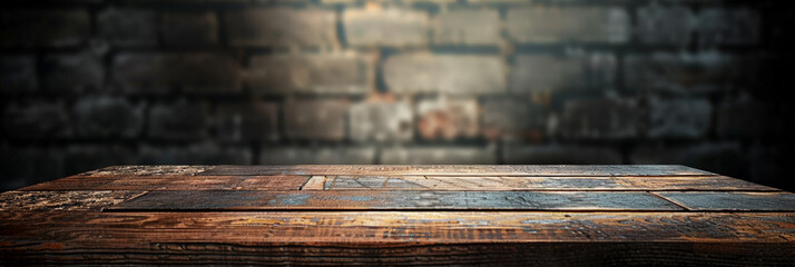 Old wood table with blurred concrete block wall in dark room background, empty wooden table