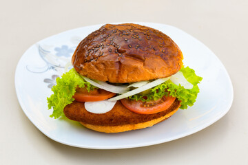 Big tasty burger with beef cutlet on a plate. Hamburger, cheeseburger with mushroom. Crispy chicken burger.