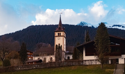 Fototapeta na wymiar Church on a cloudy spring day at Grindelwald, Interlaken-Oberhasli, Bern, Switzerland