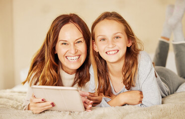 Mother, girl and tablet for portrait on bed, internet and social media for meme or online joke. Mama, daughter and relax in home for bonding and love, family and streaming comedy movie or series