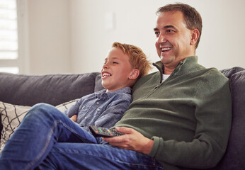 Funny, man and child together watching tv on sofa, couch and relax at home in living room....