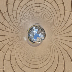 blue hole sphere little planet inside sand or dry grass round frame background