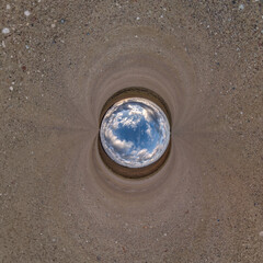 blue hole sphere little planet inside sand or dry grass round frame background