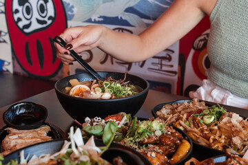 Woman eating ramen at a Japanese restaurant in Perth, Australia