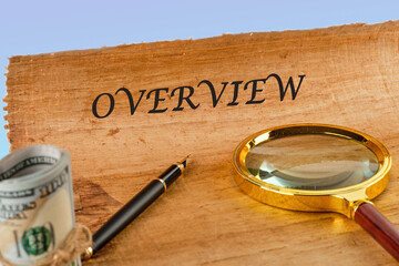 OVERVIEW written on papyrus next to a magnifying glass and money