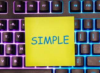 SIMPLE word it is written on a yellow sticker on the illuminated keyboard