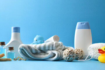 Bath products for children on blue table and blue background