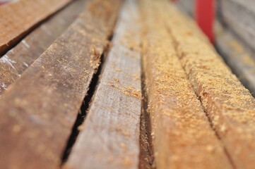 the texture of the scattered boards and wood fibers