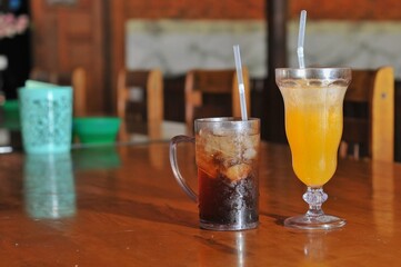 iced tea and orange juice on table