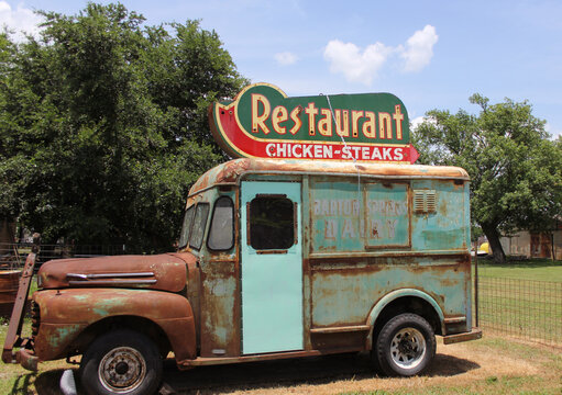 Granger TX: June 7, 2023 - Antique Restaurant Sign on Roof of Vintage Truck