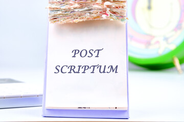 POST SCRIPTUM ancient Latin saying meaning - afterthought, afterwards text on the desktop calendar