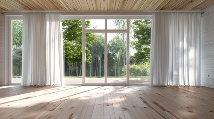 A large open room with white curtains and a window