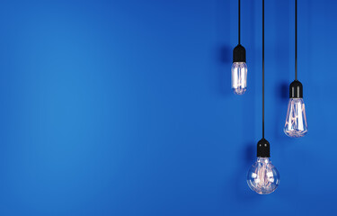 Vintage hanging light bulb on blue background. 3d rendering