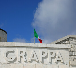 Pieve, TV, Italy - March 13, 2024: Text on Italian Military Memorial that means the place Grappa Mount of First World War