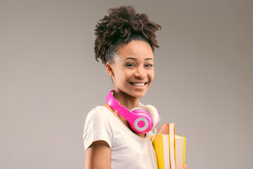 Fashion meets study, woman with vibrant headphones