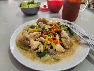 Mie Kering or Mie Titi is one of the most famous Makassar dishes. Mie Titi served with thick gravy and sliced chicken, shrimp, mushrooms, liver, and squid