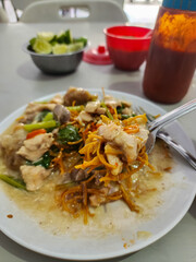 Mie Kering or Mie Titi is one of the most famous Makassar dishes. Mie Titi served with thick gravy and sliced chicken, shrimp, mushrooms, liver, and squid