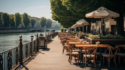 Fototapeta premium Un café pittoresque au bord d'un canal, avec des tables en terrasse surplombant l'eau, des bateaux amarrés le long des berges, et des passants se promenant le long des quais pavés.
