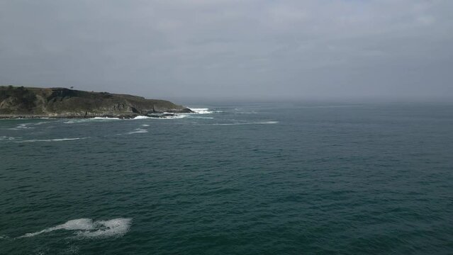 Aerial drone shot of beautiful sea view under cloudy sky