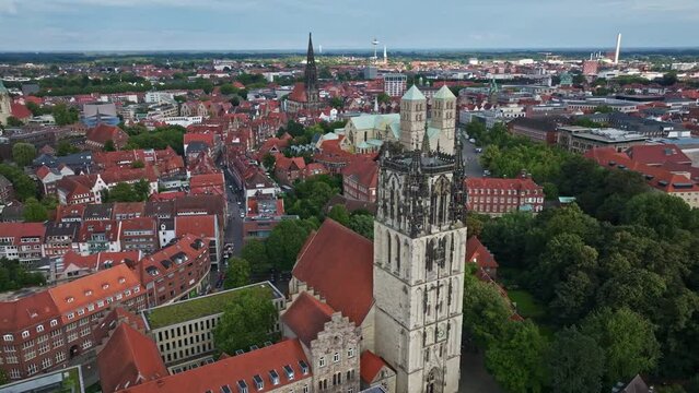 An aerial drone view of Liebfrauen-&Uuml;berwasserkirche, also known as St. Marien &Uuml;berwasser, in M&uuml;nster, Germany. This Gothic hall church, commonly referred to as &Uuml;berwasserkirche .
