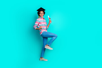 Photo of cheerful happy man wear trendy striped clothes finish college isolated on cyan color...