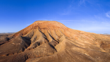 Aerial Panoramic view of the majestic Volcanic Mountain of Montana Roja Fuerteventura Canary Islands Spain