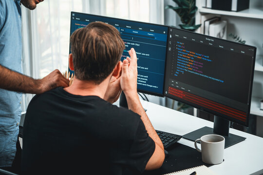 IT developers discussing online software development information on pc screen, creating program coding for latest version application on website. Concept of brainstorming firmware updated. Sellable.