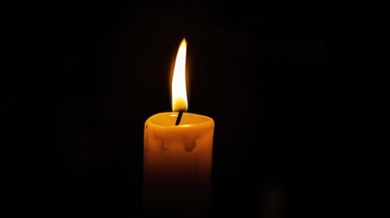 In a dark room, one candle glows for hope and memory on Support of Victims of Torture Day. International Day in Support of Victims of Torture