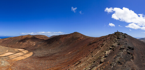 Dramatic aerial image of the volcanic mountains landscape and Calderon Hondo near Corralejo in Fuerteventura Canary Islands Spain