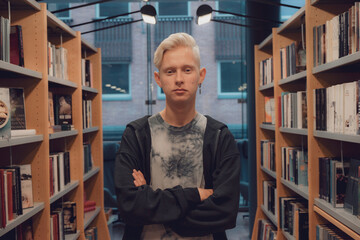 Portrait of a handsome Scandinavian student in a modern library