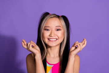 Photo of charming adorable cute girl wear trendy clothes showing gesture crossed fingers isolated on purple color background