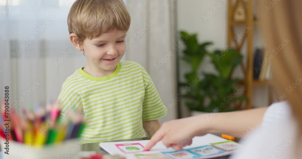 Poster child playing with colorful learning blocks