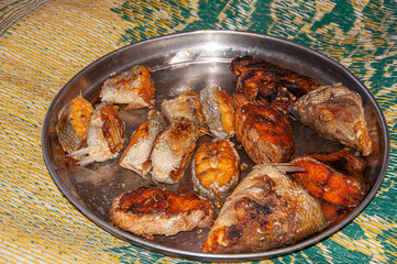 fried fish on an iron dish. A common food for the inhabitants of an island in the Indian Ocean.