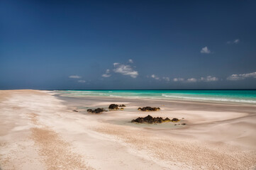  coast of an island in the Indian Ocean. Emerald water, pristine beaches, wild rocky shores....