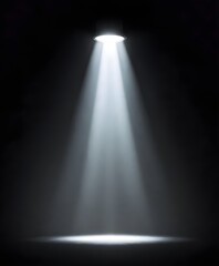 A bright spotlight shining down on a a dark, foggy background