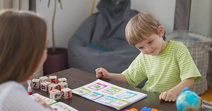 Child Learning Language With Educational Cards