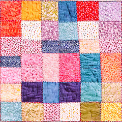 A handmade patchwork quilt featuring a variety of colorful fabrics Transparent Background Images 