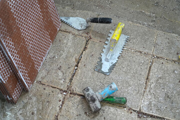 Tiling Notched Trowel Equipment on the Bathroom Flooring