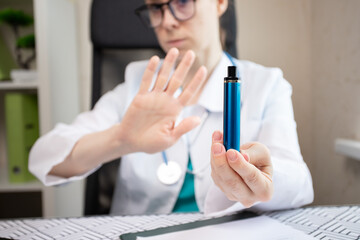reject disposable cigarette,stop smoking,doctor shows a sign of refusal of vape smoking