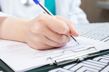 Medical documents, insurance contract signing, healthcare coverage