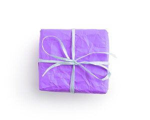 Top view of crumpled paper lavender color present box with recycled paper ribbon isolated on white