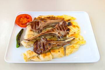 Beef steak grill with rice pilaf, fried potatoes, grilled pepper