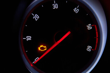 Check engine error light illuminated on car dashboard