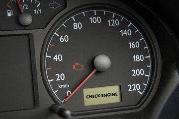 Check engine error light illuminated on car dashboard