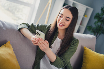 Photo of pretty young woman texting smart phone wear shirt modern interior apartment indoors - obrazy, fototapety, plakaty