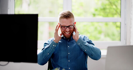 Man Covering Ear With Hands