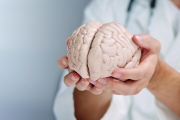 Surgeon holding brain while neurologist