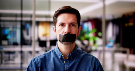 Young Man With Black Duct Tape Over His Mouth