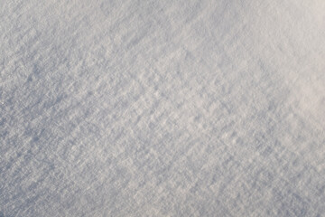 Snow background, top view. Fresh snow texture. Winter backdrop for publication, poster,...