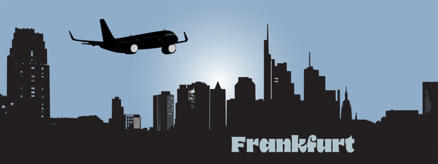 Skyline silhouette of buildings in Frankfurt with passenger Airplane, the financial centre in Frankfurt am Main, Germany